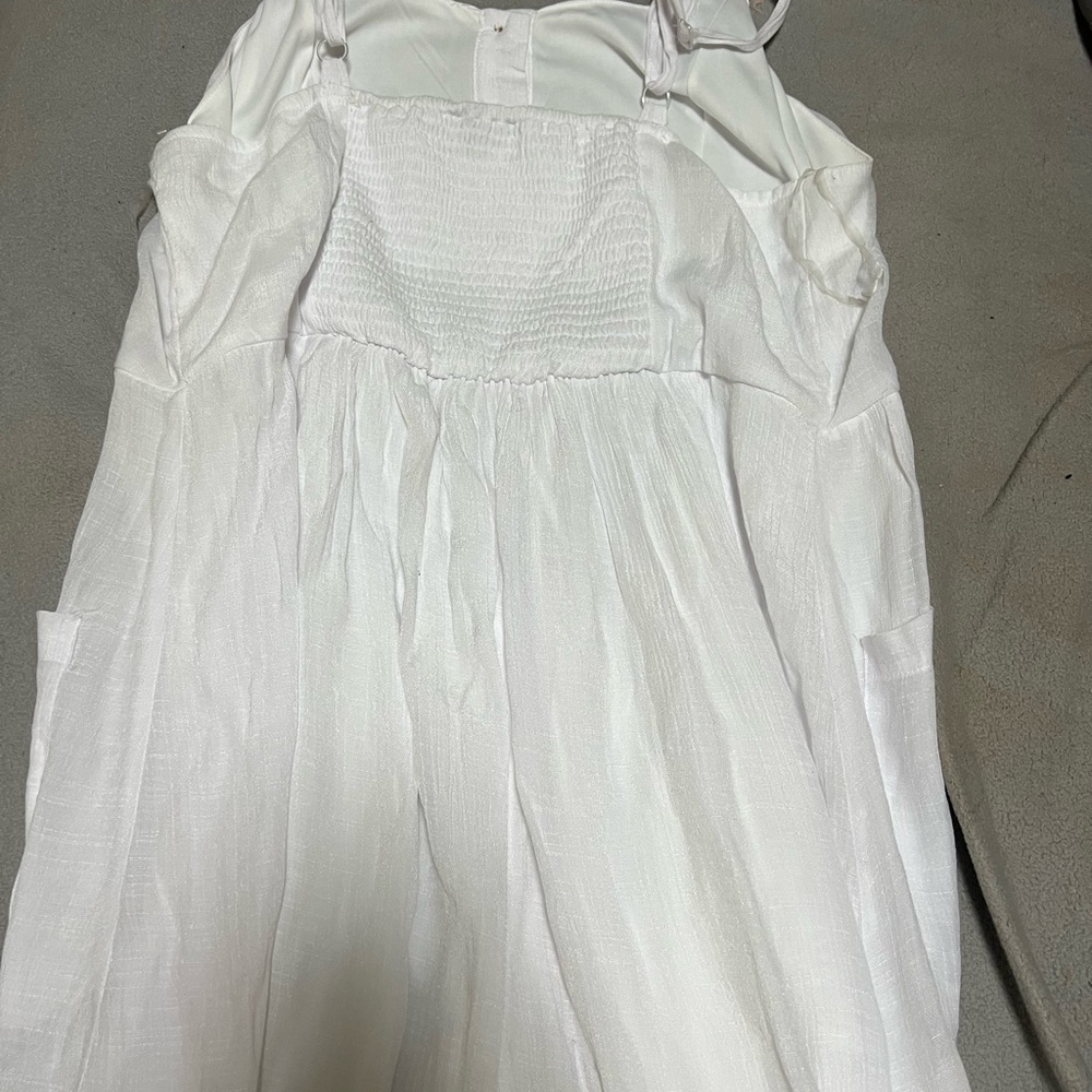 This summer dress by Mlle Gabrielle, has never been worn. It’s very lightweight.